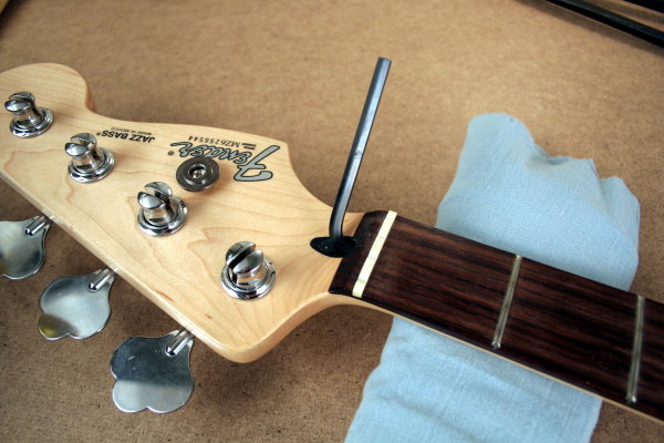 Turn truss rod with Allen socket wrench 2 quarters clockwise